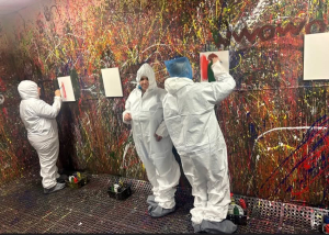Adult Program clients enjoying a creative painting session at Splatter Craze, exploring color, self-expression and hands-on art.