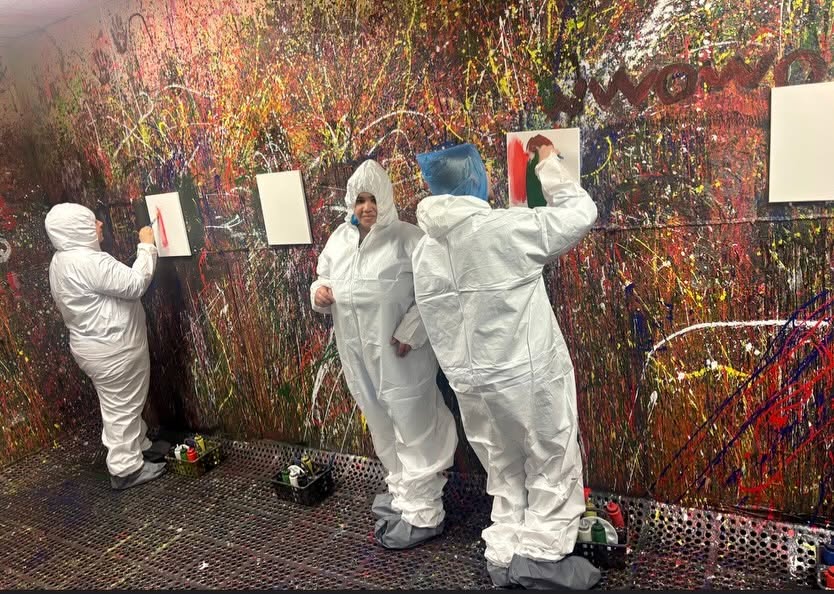 Adult Program clients enjoying a creative painting session at Splatter Craze, exploring color, self-expression and hands-on art.