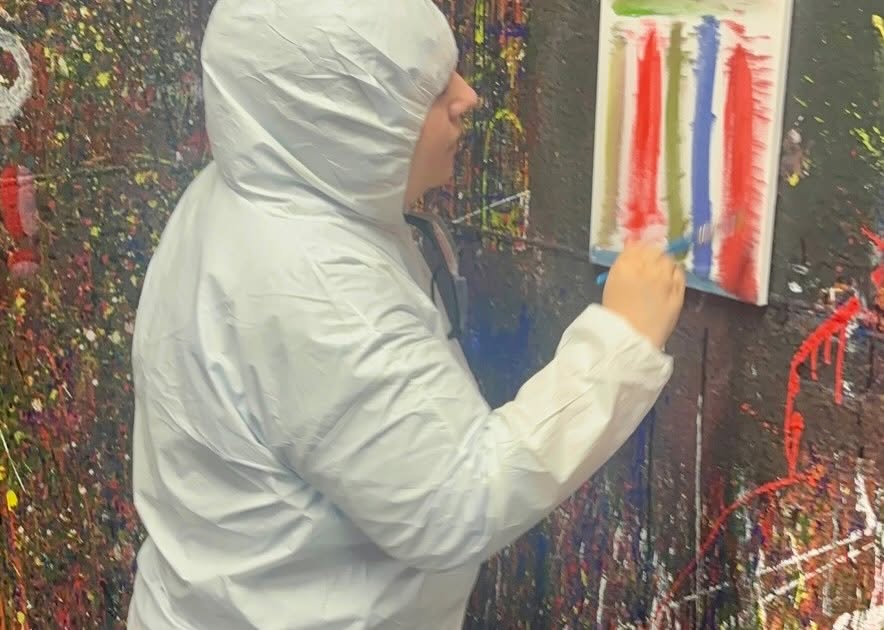 Adult Program clients enjoying a creative painting session at Splatter Craze, exploring color, self-expression and hands-on art.