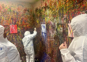 Adult Program clients enjoying a creative painting session at Splatter Craze, exploring color, self-expression and hands-on art.