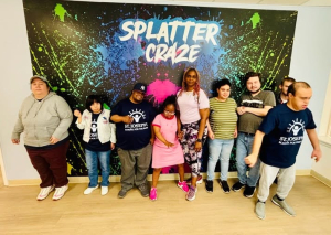 Adult Program clients enjoying a creative painting session at Splatter Craze, exploring color, self-expression and hands-on art.