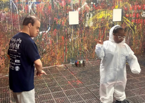 Adult Program clients enjoying a creative painting session at Splatter Craze, exploring color, self-expression and hands-on art.