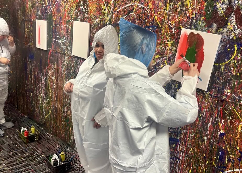 Adult Program clients enjoying a creative painting session at Splatter Craze, exploring color, self-expression and hands-on art.