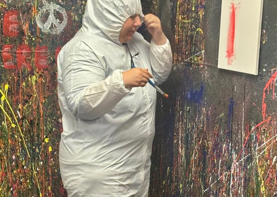 Adult Program clients enjoying a creative painting session at Splatter Craze, exploring color, self-expression and hands-on art.