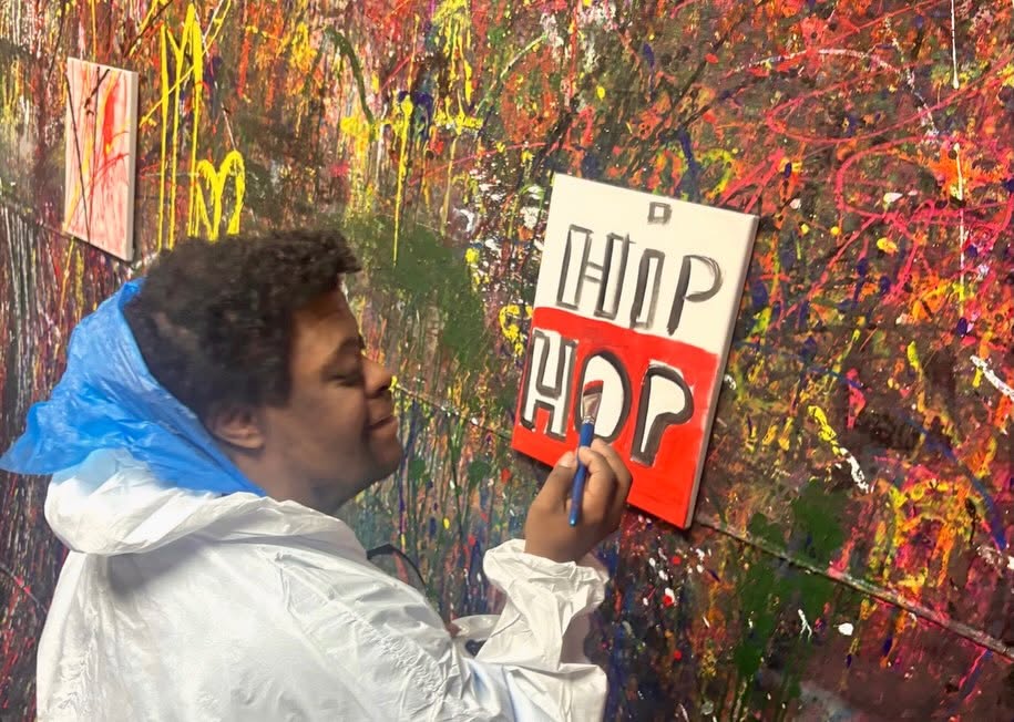 Adult Program clients enjoying a creative painting session at Splatter Craze, exploring color, self-expression and hands-on art.